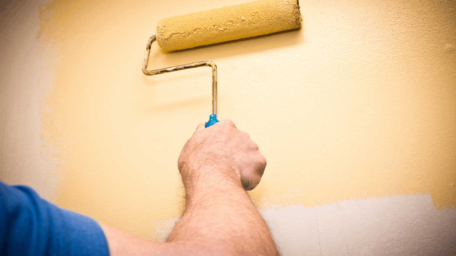 Professional painter painting over old interior paint in Atlanta, GA