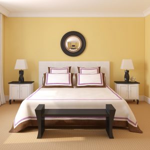 Beautiful yellow painted bedroom interior.