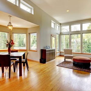 Fantastic painted modern living room home interior. Dining room. Huge green bright room with modern furniture.